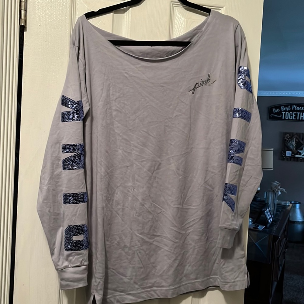 Pink long sleeve purple shirt with logo down both arm
